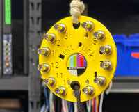 Yellow Butt Puck holding fiber barrels on set